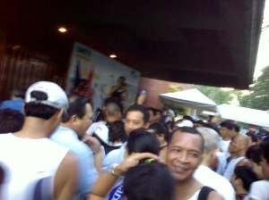 06142009617 that's Fr. Robert Reyes blessing us (really, that hand with a bottle. that's him! that's all i got to capture.)