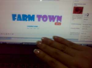 06182009660 Farm Town while having my manicure and pedicure